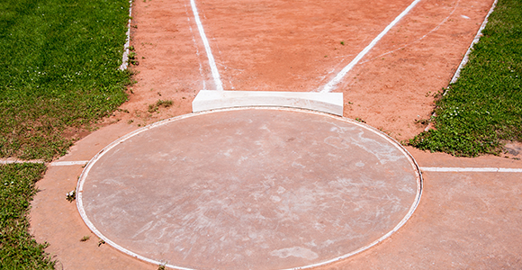a shotput arena with a circle where the athlete stands